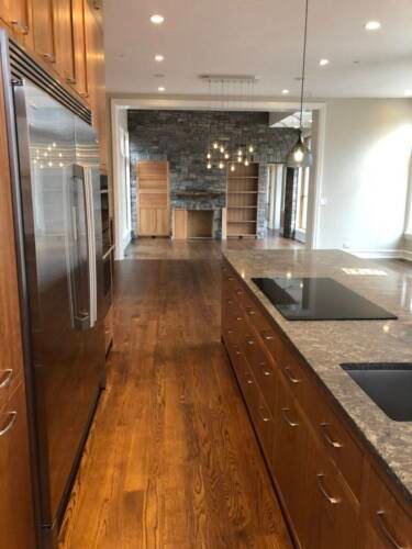 New Single Family Construction - Integrity Construction Consulting, Inc. - Hardwood Flooring in Kitchen Area